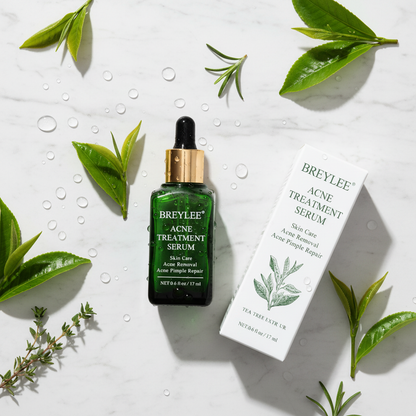 BREYLEE Acne Treatment Serum — marble flatlay with tea tree leaves