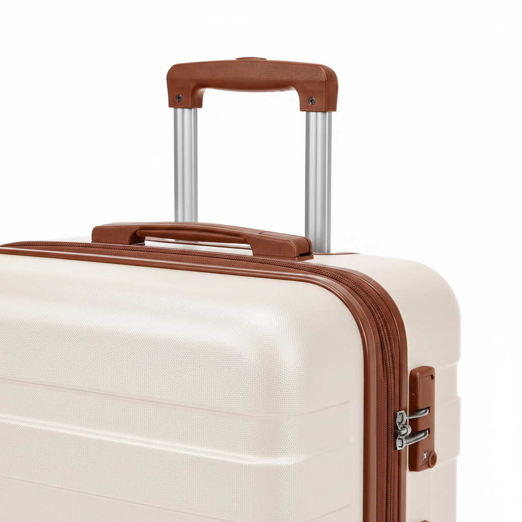 Close-up of ivory suitcase TSA lock and brown spinner wheels